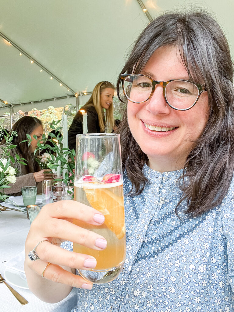 Nikki holding a drink. Solo trip